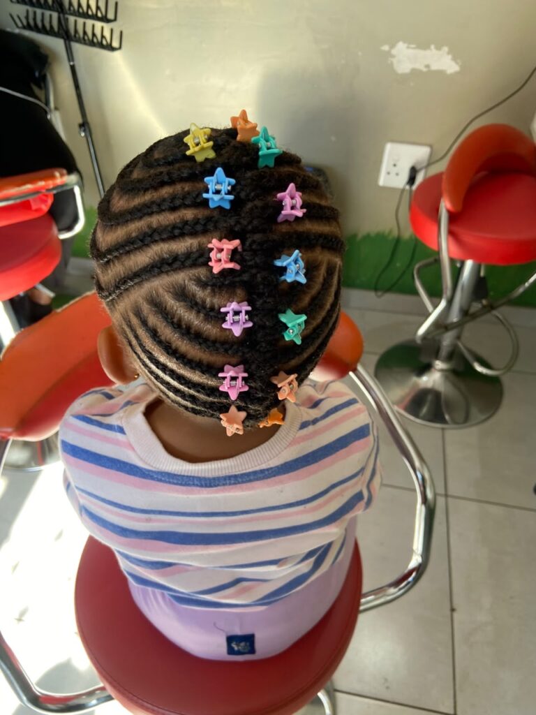Colourful beaded braids for kids at Melza Kids Hair Salon